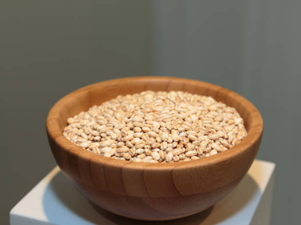 istock Pearl Barley inside Wooden Bowl 676125376