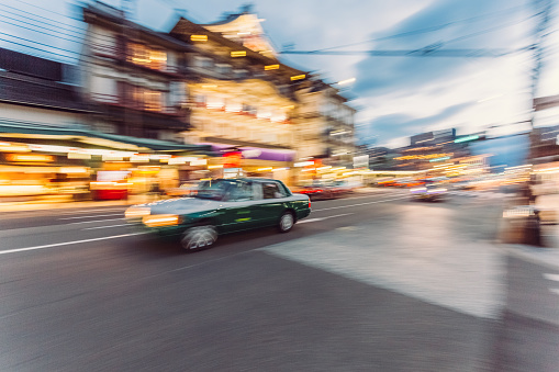 Blurred motion of fast moving car in the city