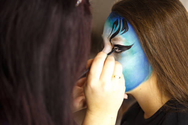 istock Girl getting a face paint at kids party 676175710