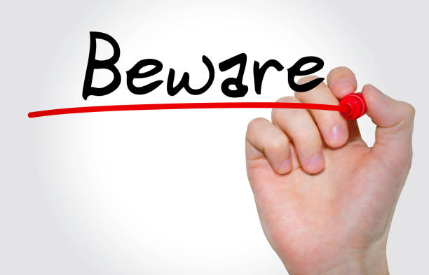 istock Hand writing inscription Beware with marker, concept 676184856