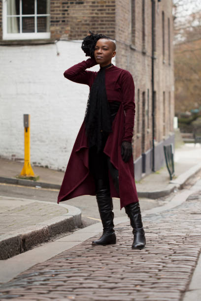 istock Woman in Boots in Street Style by a River 676211994