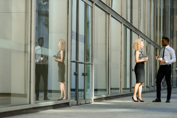 istock Business colleeagues walking along the office building 676221154