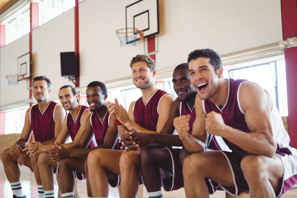 istock Excited basketball player sitting on bench 676233896