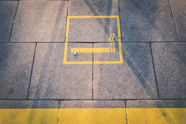 istock cigarette , smoking area symbol on floor 676247430