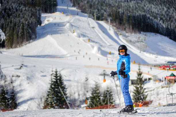 istock Female skier on a ski slope at a sunny day 676253832