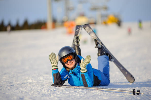 istock Young woman skier after the fall on mountain slope 676273988