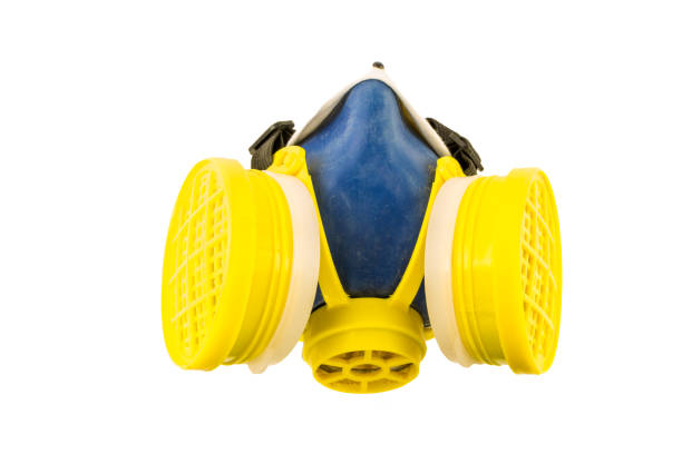 istock Yellow and blue respirator top view isolated 676285404