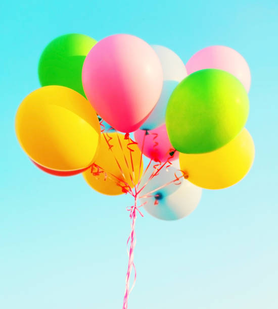 istock Big colorful bundle of air balloons on a blue sky background 676287552