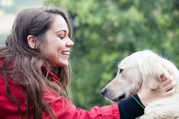 istock Girl petting the dog 676313680