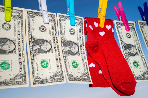 Clodhes line with red socks and handing dollars