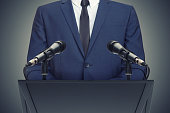 Businessman or politician making speech behind the pulpit