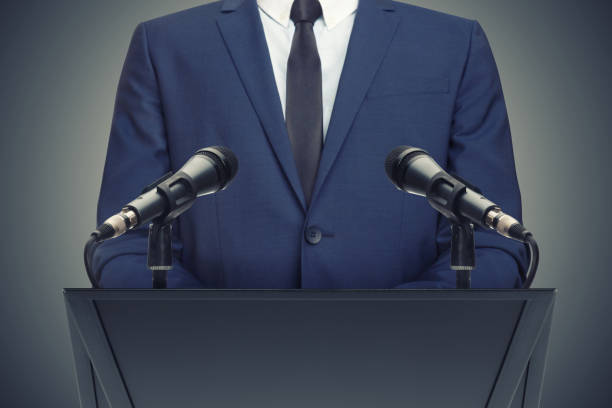 Businessman or politician making speech behind the pulpit stock photo