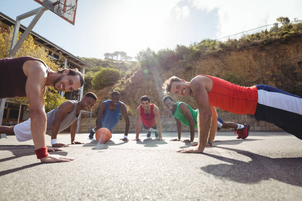 istock Basketball players performing push up exercise 676327604