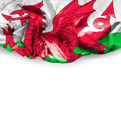 Waving flag of Wales isolated on white background