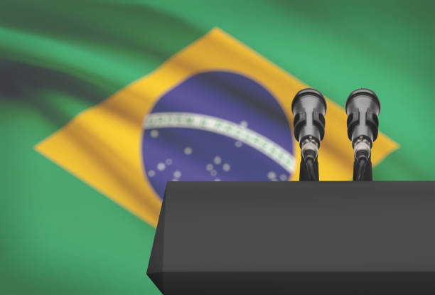 istock Pulpit and two microphones with a national flag on background - Brazil 676361592