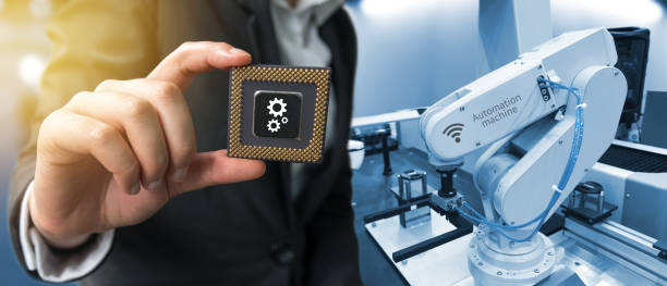 istock Industry 4.0 , Machine learning and artificial intelligence concept. Man suit hand holding Ai chipsets and blue tone of automate wireless Robot arm in smart factory background with flare light effect 676364506