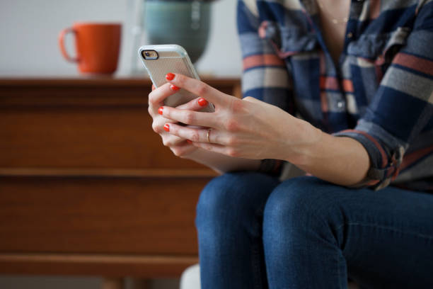 istock Woman Working or Playing on her Smartphone 676366702