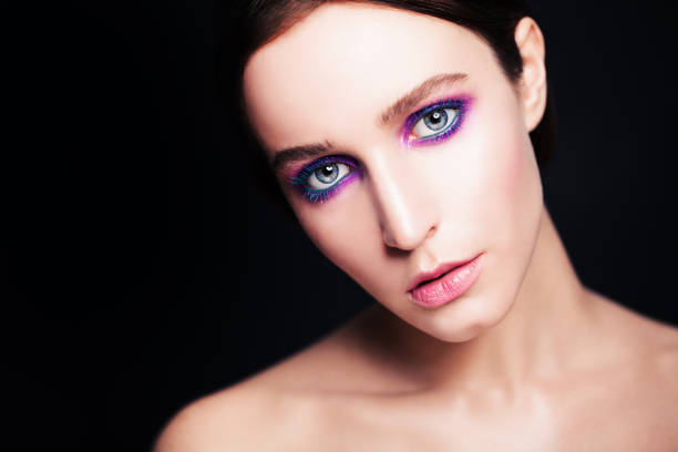 istock Fashion Model with Bright Make-up on Dark 676368264