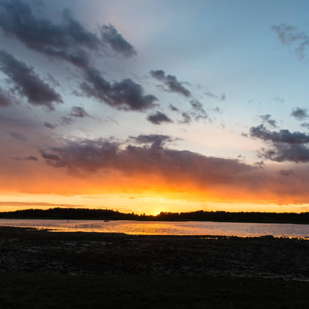 istock Beautiful sunset over the lake 676380760