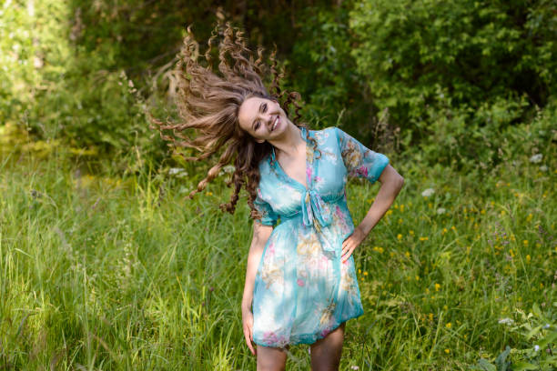 istock A young brunette girl lupine meadow 676407614