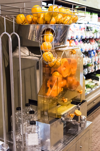 Fresh Orange Juice Machine in a supermarket