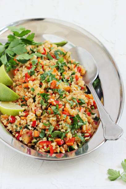 istock Tabbouleh.Traditional bulgur salad with vegetables and herbs. 676452158