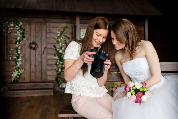 Photographer shows the bride had just taken photos stock photo