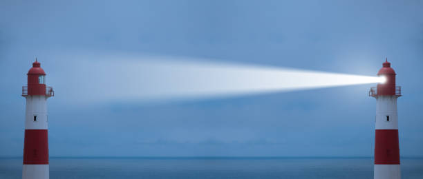 istock Being the bright one, lighthouses in action with beam, sea in background 676485672
