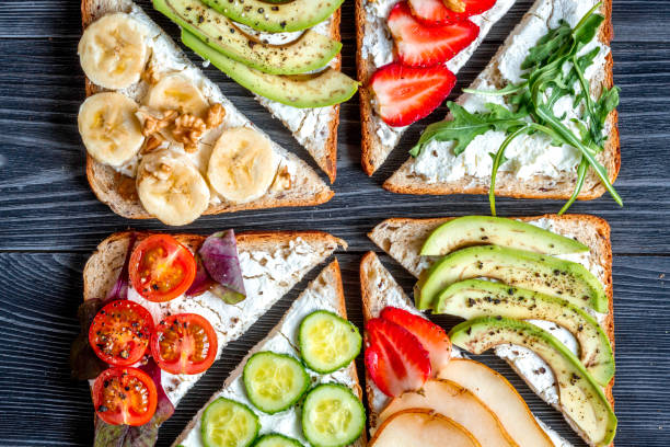 istock healthy breakfast with sandwiches set on white background top view 676485878