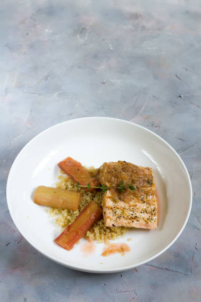 istock Grilled salmon with quinoa and rhubarb sauce. 676531188