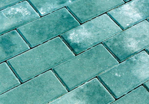 istock Cyan color cobblestone pavement texture. 676542160