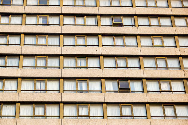 istock Geometrically correct architectural background of modern office building or urban housde facade 676543330