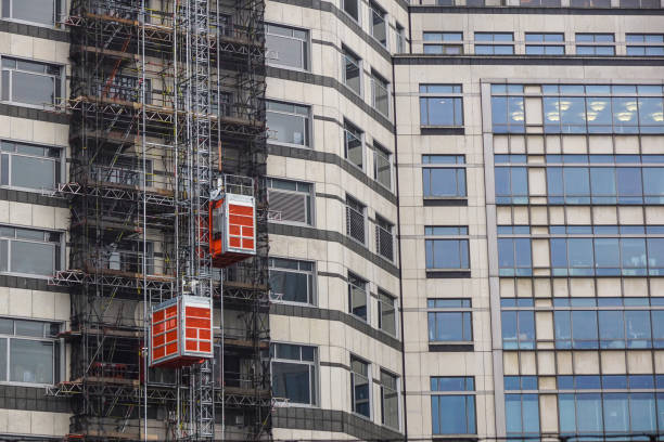 istock external hoists used in building construction to bring work materials 676549914