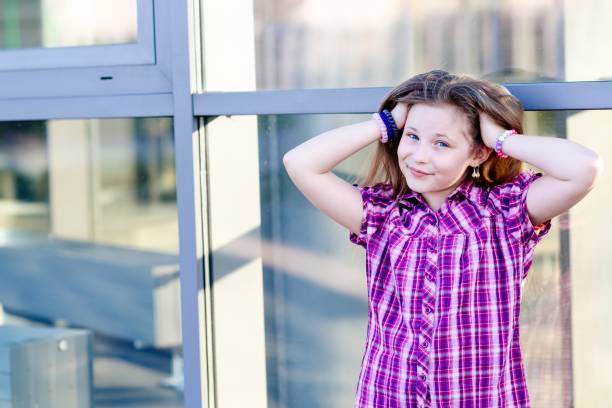 portrait of happy blond hair ten years girl - 10 11 years child human face female imagens e fotografias de stock