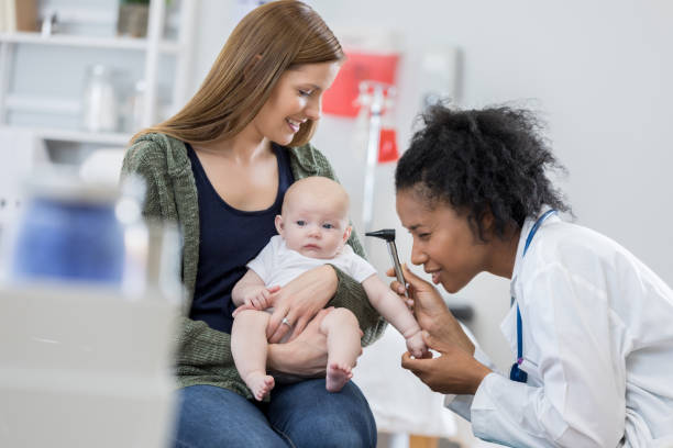 istock Pediatrician examines baby during well check appointment 676570556
