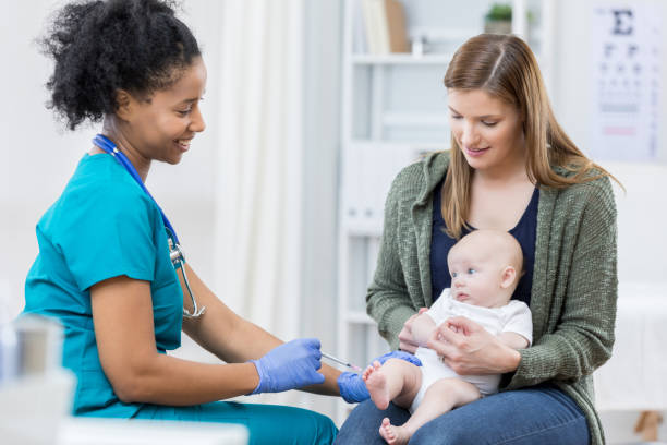 istock Nurse gives female infant an immunization 676570624