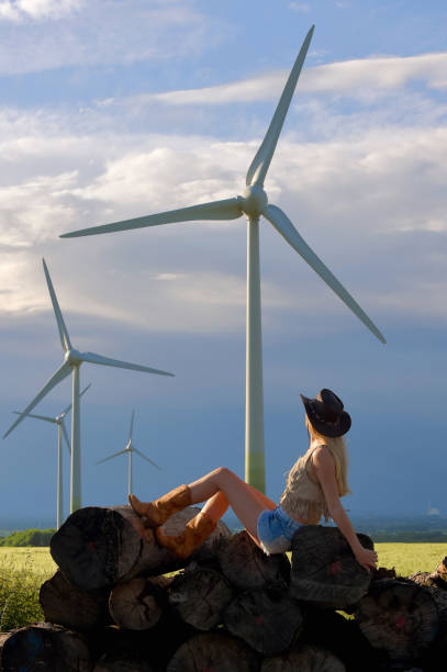 istock Cowgirl and Windmills 676572346