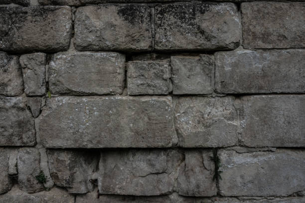 istock The old and ancient stone wall of a building 676593384