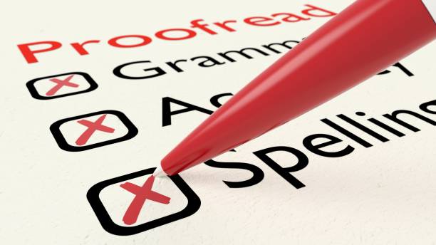 Checklist of proofreading characteristics grammar accuracy and spelling on paper crossed off by a red pen stock photo