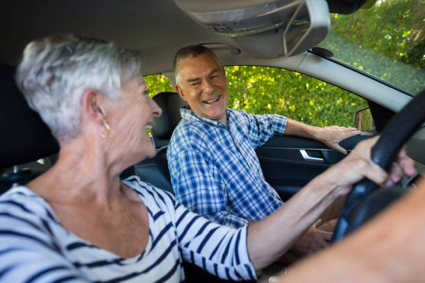 istock Senior couple sitting in car 676624242