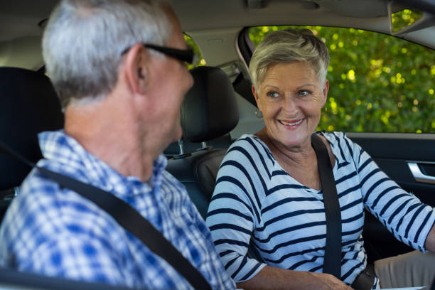 istock Senior couple looking at each other in car 676631692