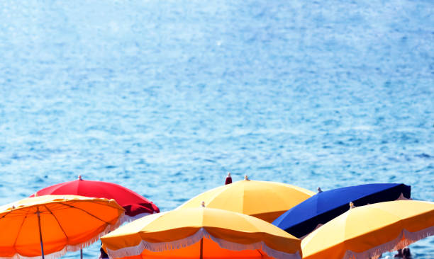 istock Beach colourful umbrellas and ocean, summer background with copy space 676656574