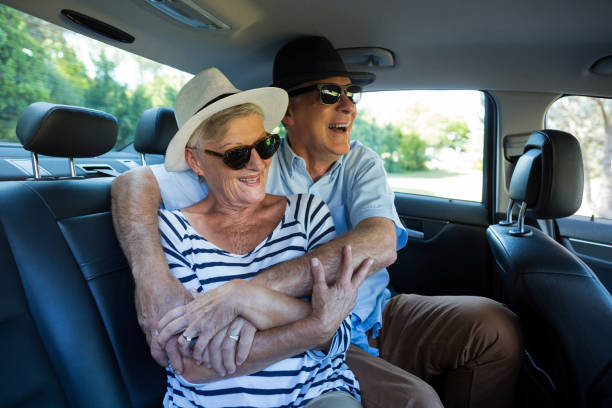 istock Senior couple enjoying on car back seat 676698344
