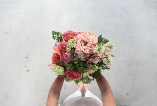 Young woman with a bouquet. Horizontal.