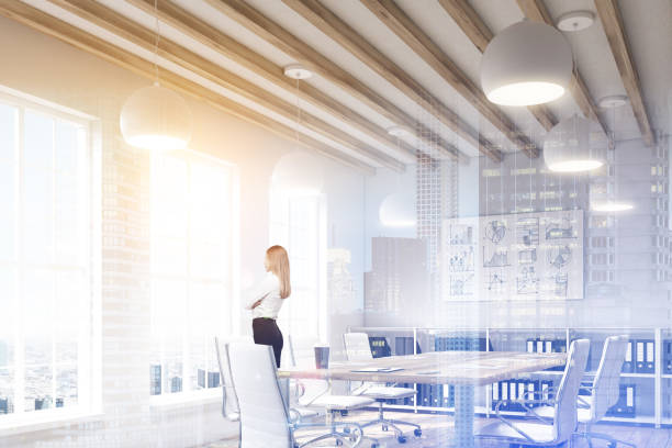 istock Blond woman in a conference room, double 676724164