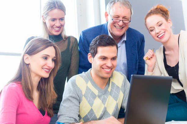 istock College students lerning with professor 676745594