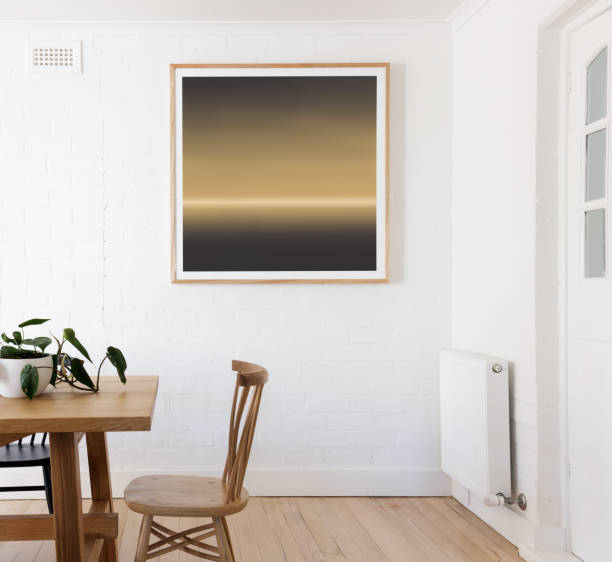 istock Yellow and black framed print on white wall in a dining room 676772326