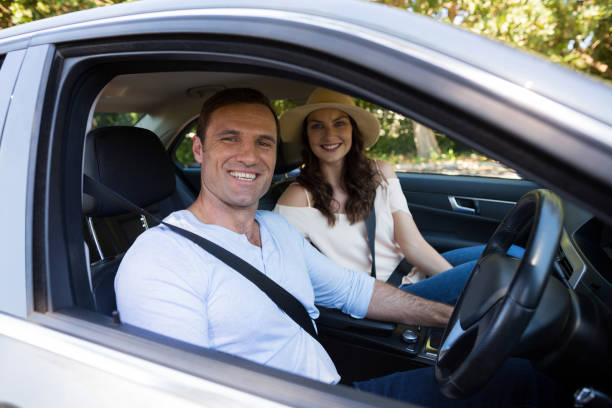 istock Young couple sitting in car 676780172