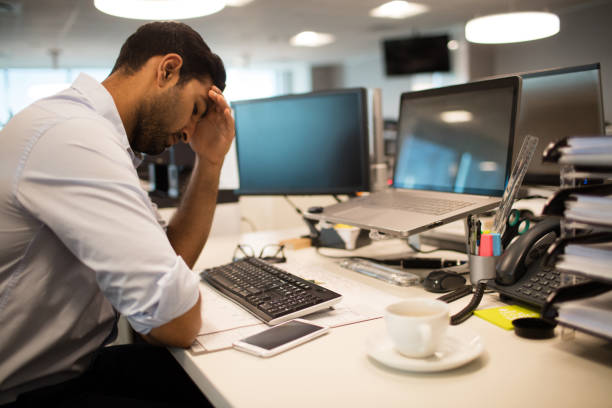 istock Restless businessman sitting in office 676817390