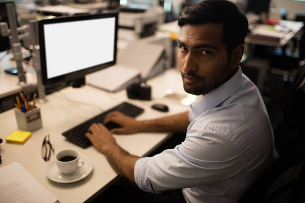 istock Serious businessman working in office 676837624